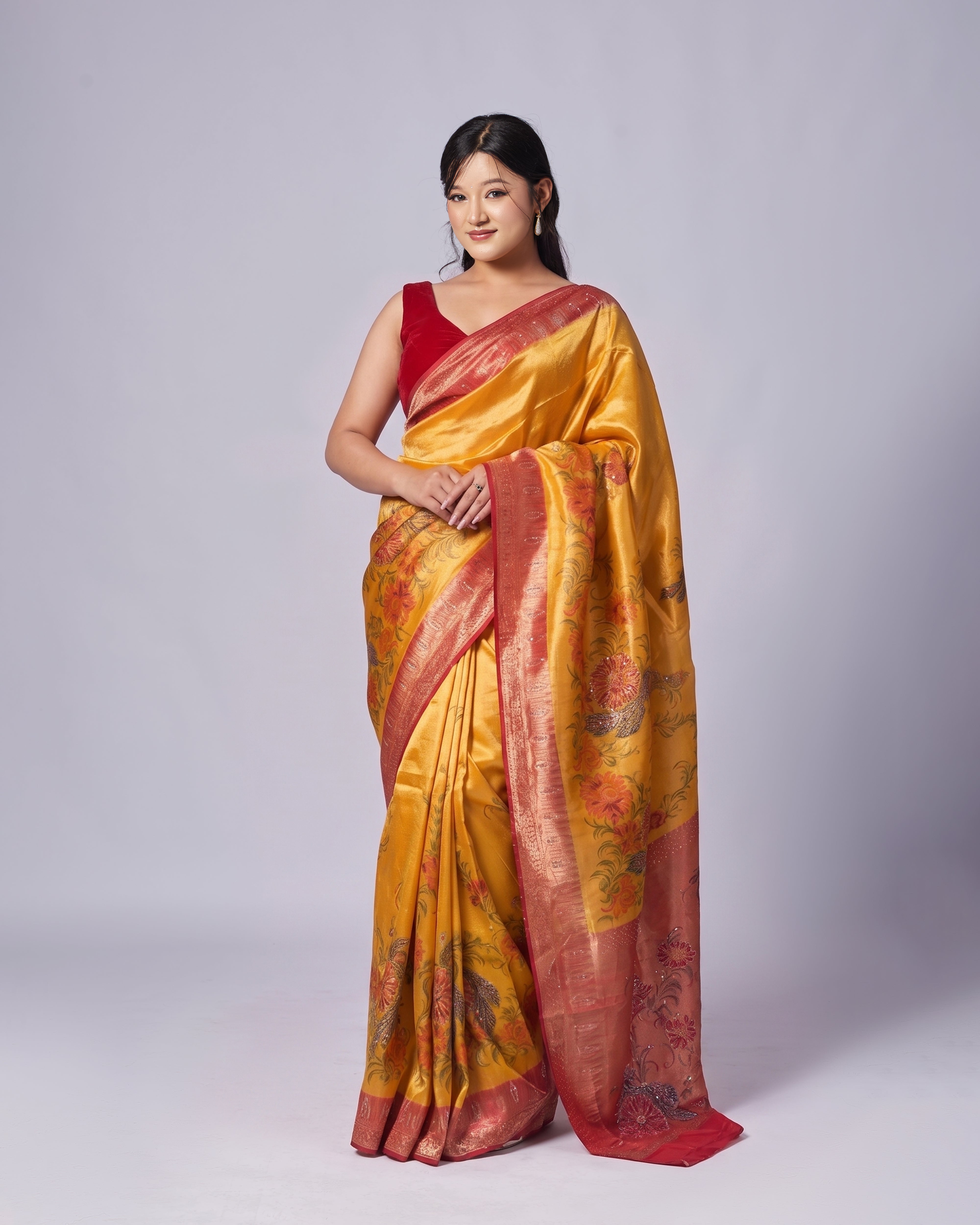 Drape yourself in timeless elegance with the Mayju Golden Bloom South Silk Saree.