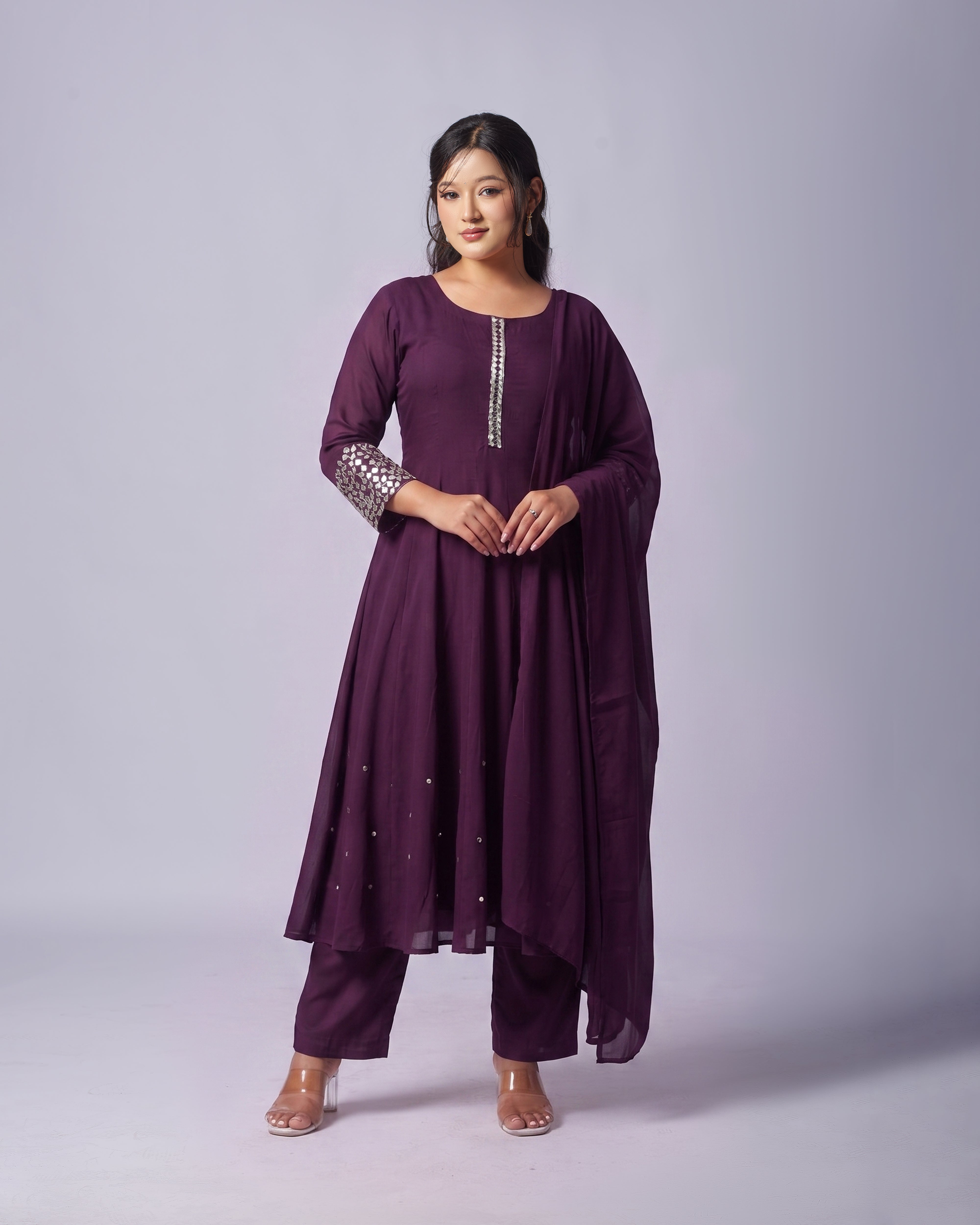 Step into understated elegance with the Mayju Royal Plum Chinon Silk Kurthi Set, designed for the modern woman who appreciates grace and comfort. 