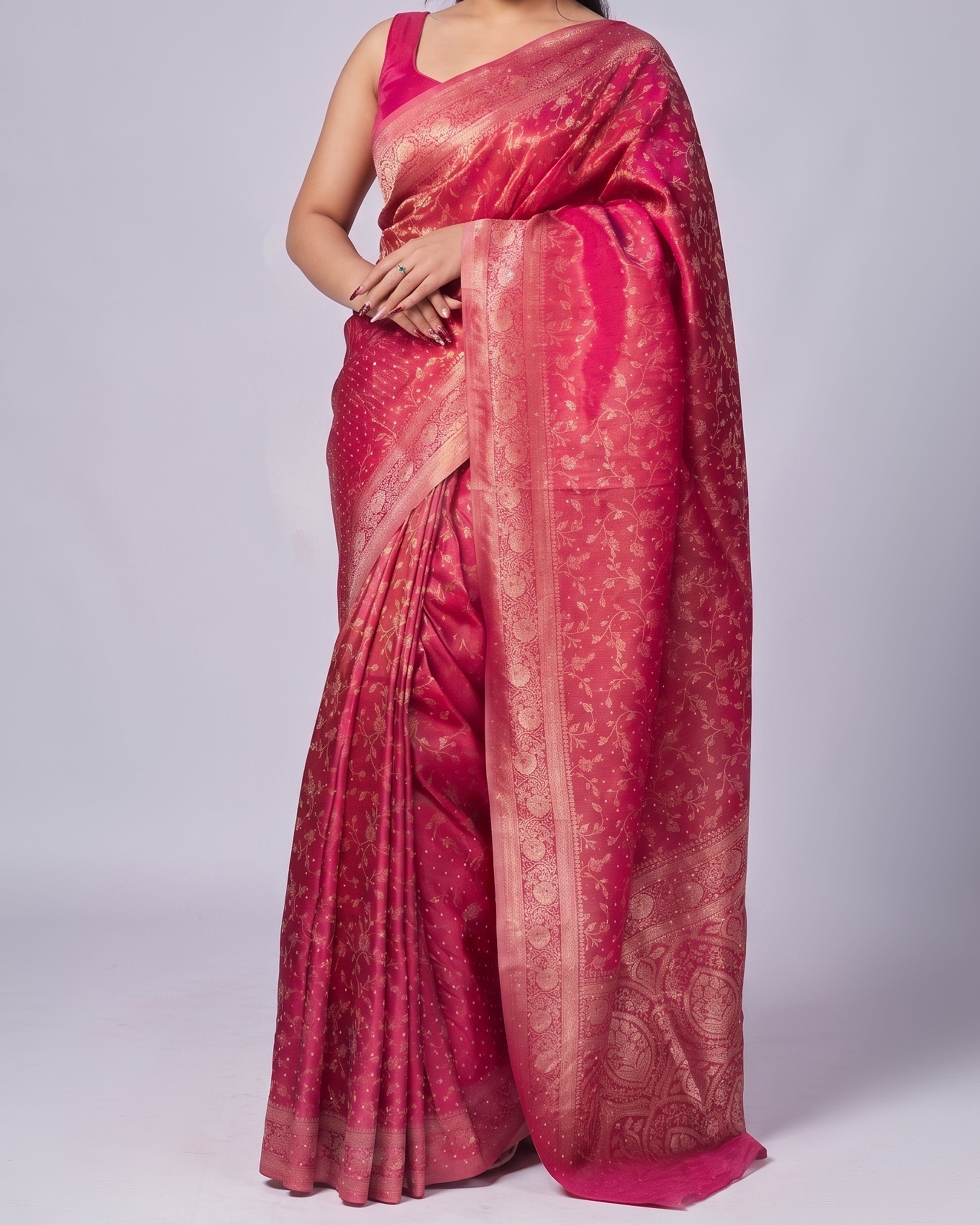 Red saree with a subtle pattern on a plain background