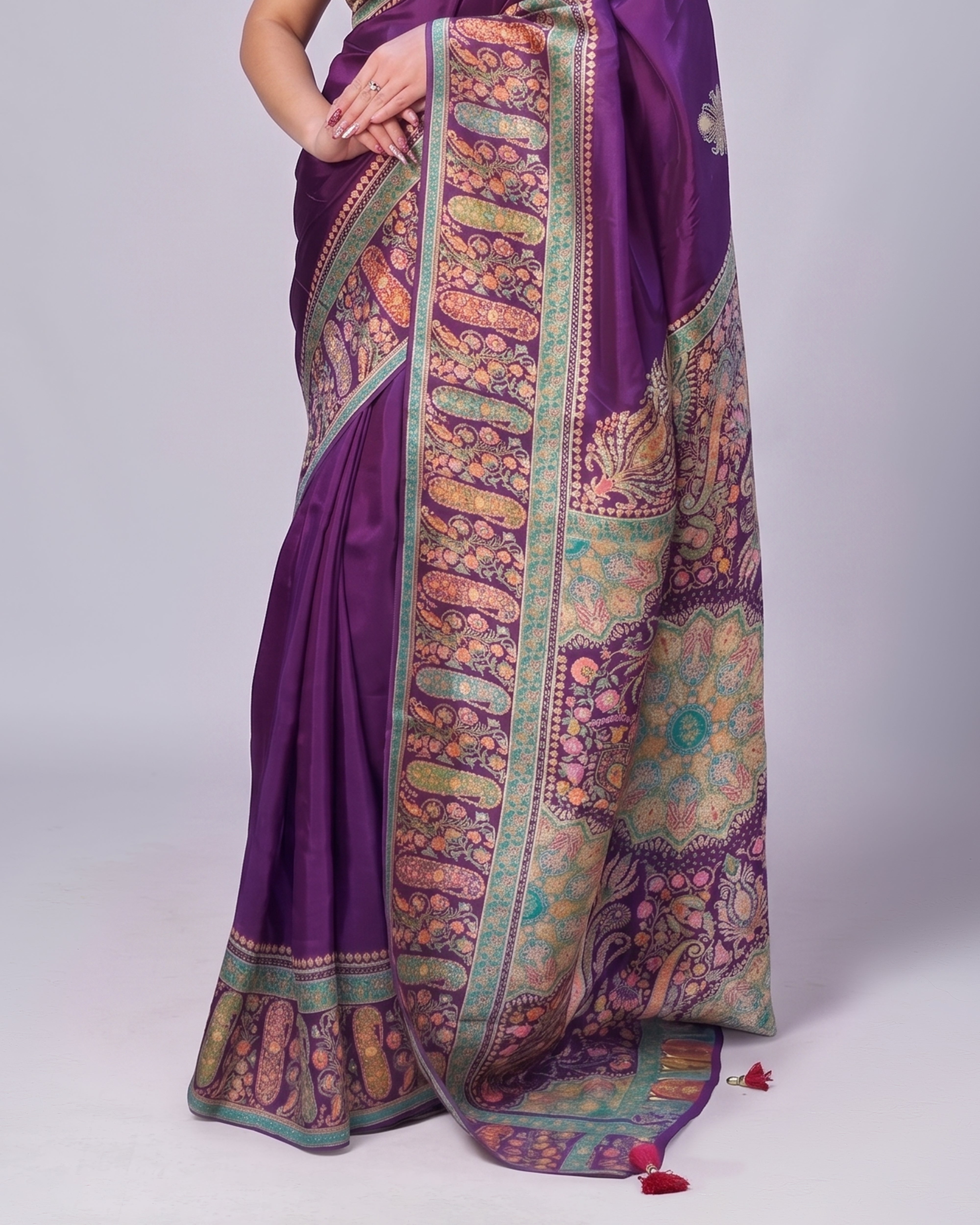 Purple saree with intricate patterns on a white background