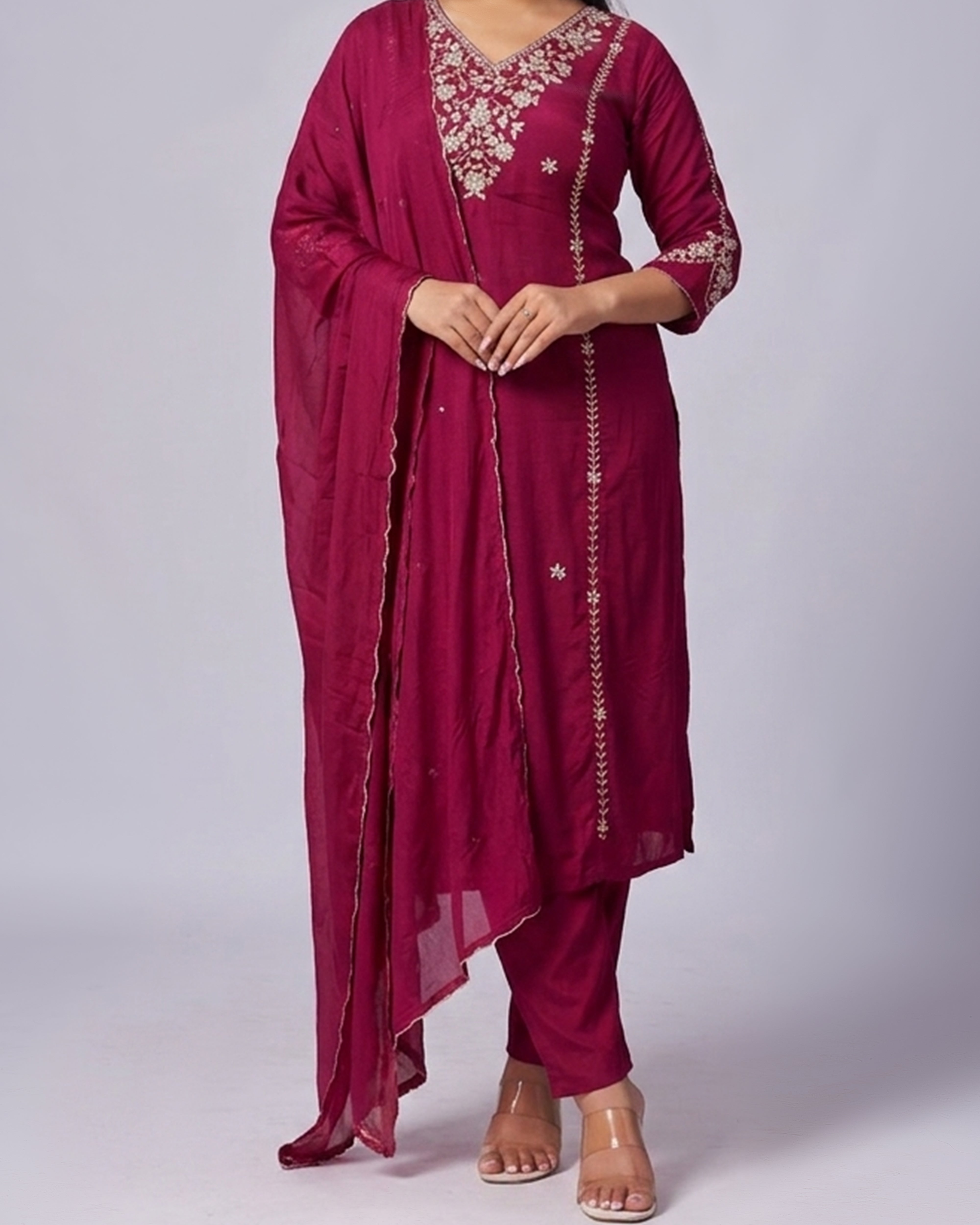 Maroon traditional outfit with embroidery on a white background